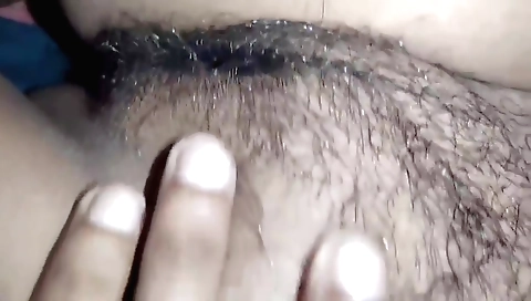 Busty brunette fucks hairy pussy in a homemade porn video