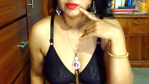 Indian brunette naked on the bed showing her sexy body