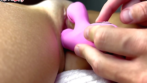 A sexy milf is sucking the big dildo with her pussy