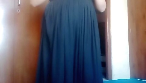 A little girl is getting on her knees and rubbing her hairy pussy