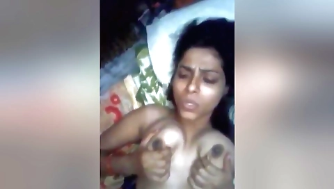 Indian chick in a sexy dress fucks herself on web cam