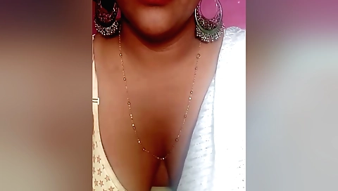 Indian brunette with large boobs fucks a big dildo