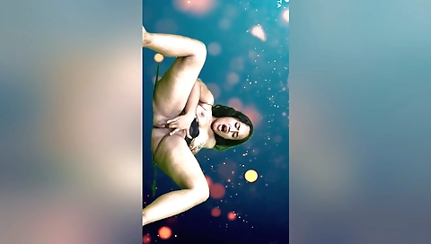 Indian brunette plays with her boobs in a sexy outfit