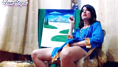 Indian woman smoking a cigarette and giving thumbs up