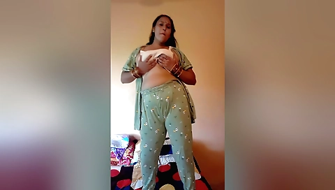 Short brunette naked dancer in white dress dance in solo