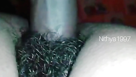 Indian amateur with a hairy pussy fucks her hairy cunt