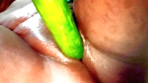 Indian wife fucks her pussy with cucumber and enjoys it