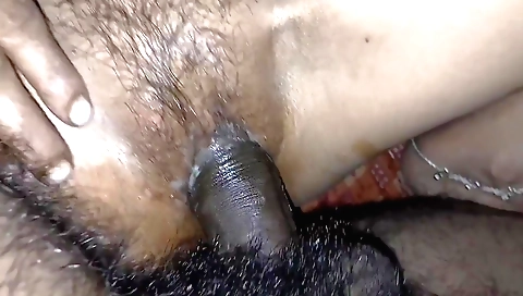 Indian girl with a hairy pussy plays with her hairy cunt