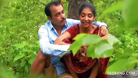 Sexy brunette with a nice ass is getting wet with rain