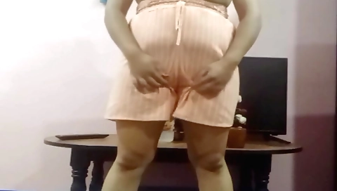 Chubby brunette gets on her knees and masturbates with a toy