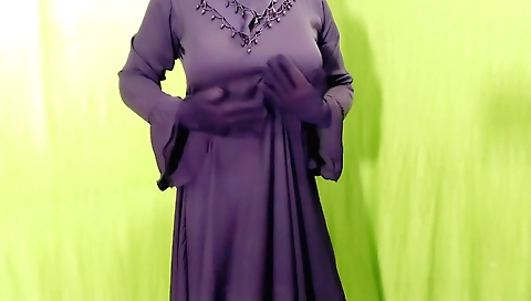 Muslim girl in a sexy black bra and sexy dress in her room