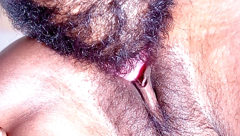 Hairy Indian babe with a long pussy enjoys licking